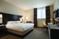 Hotel Executive Suite Bedroom Furniture Double Bed with TV storage Cabinets by Dark oak wood and Reception Living Sofa