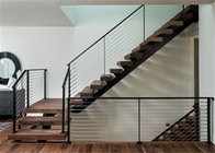 Interior double spine wood tread straight staircase with rod bar railing
