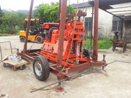 Trailer mounted water well drilling rig