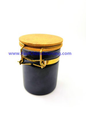 China custom 150ML black BOROSILICATE glass jar WITH bamboo lid with gold clamp , gross and matt surfaces supplier