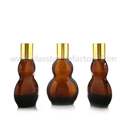 China 30ml and 50ml New Model Double Calabash Amber Essential Oil Bottles With Gold Caps supplier