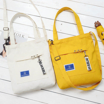 China Unique design canvas diagonal Korean fashion shoulder bag handbag with ribbon supplier