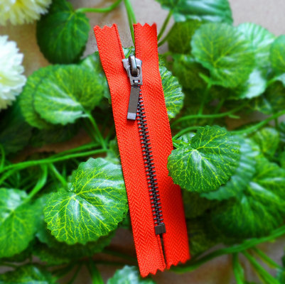China Customized Closed End Zipper #5 With Auto Lock Slider , Long Puller And Red Tape supplier