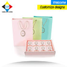China paper packaging bags paper bags paper handbags custom clothing bags with rope hangs for giveaways shoes bags